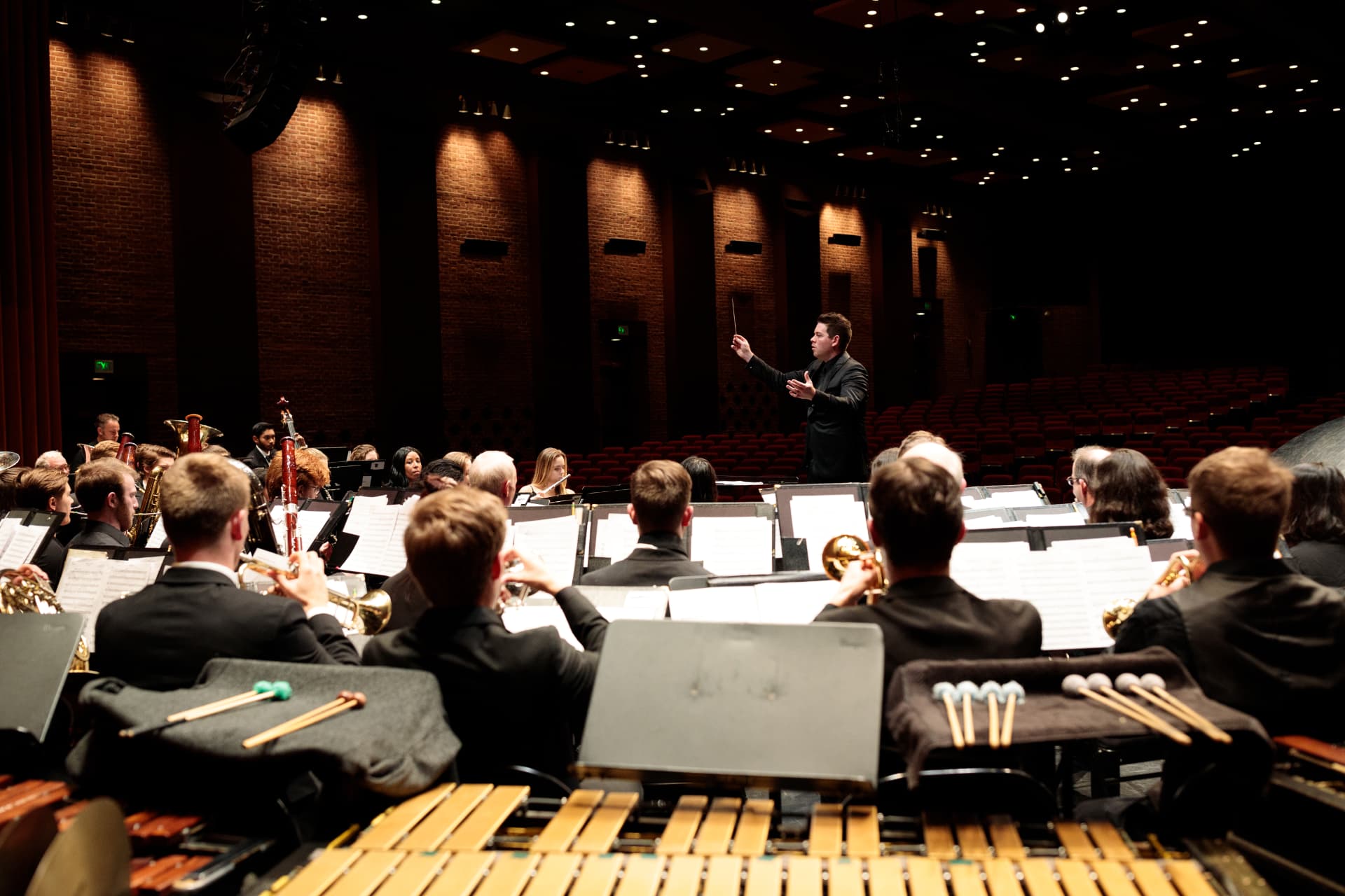 The Valley Winds performing in concert with conductor on the podium